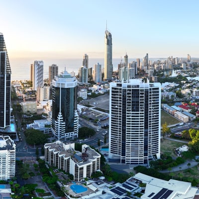 A panoramic view of a city skyline with waterways and buildings.